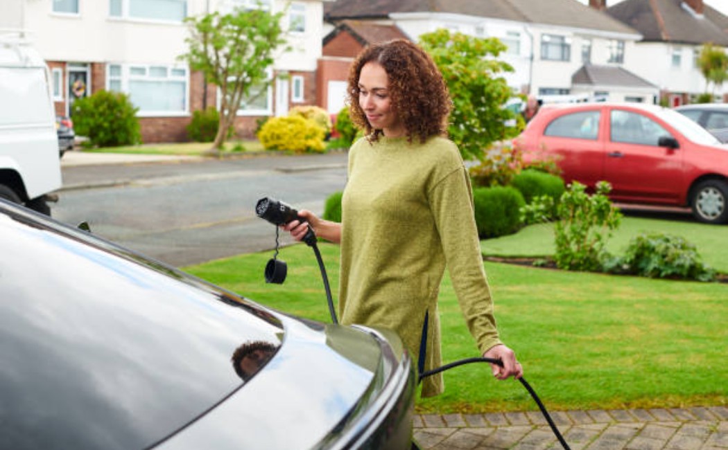 Green living concept: family garage, electric car charging ready
