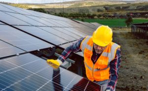 Elevating energy, a professional aligning rooftop solar panels